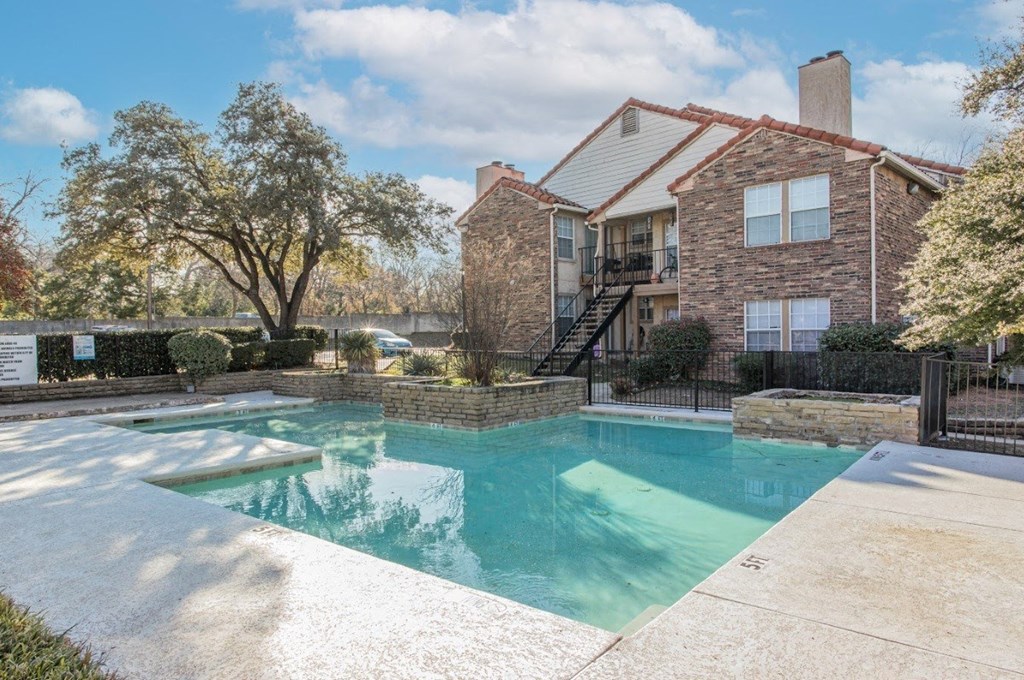 A house with a pool in the backyard.