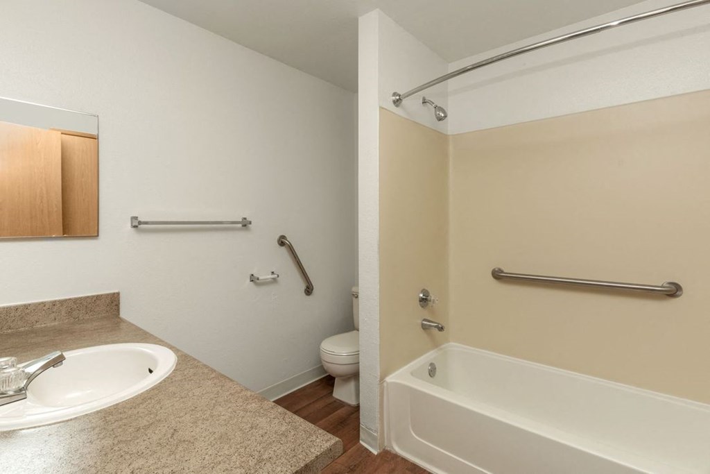 Silver Shadow Apartments bathroom with tub shower