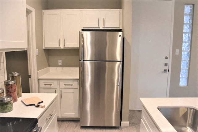 Soho Apartments kitchen area with refrigerator