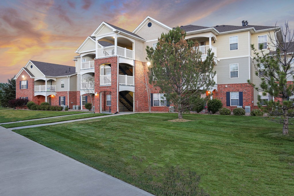 A large apartment complex with multiple buildings and balconies.