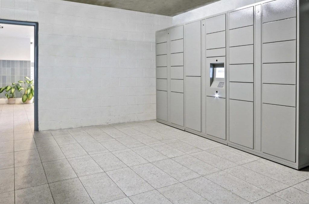 A row of turnstiles in a modern building.