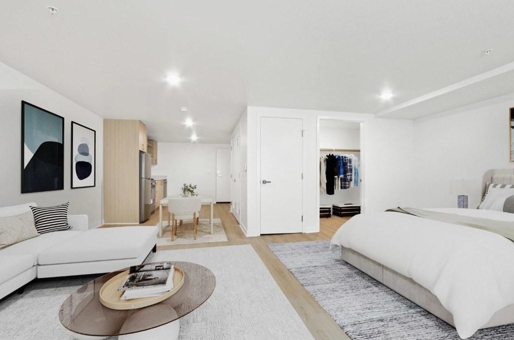 A modern living room with a white couch and a coffee table.
