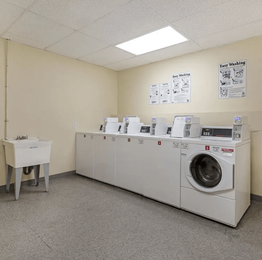 a washer and dryer in the laundry room of a building