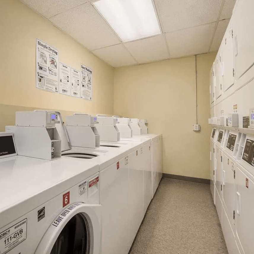 a washer and dryer room in a building with washing machines