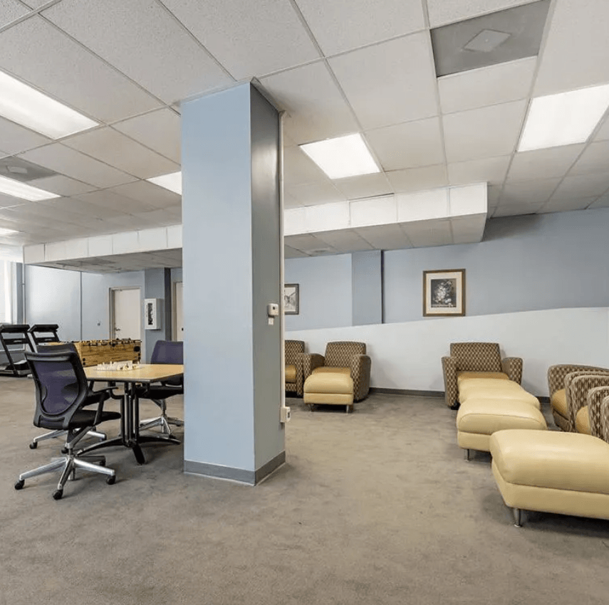 a room with a table and chairs in it