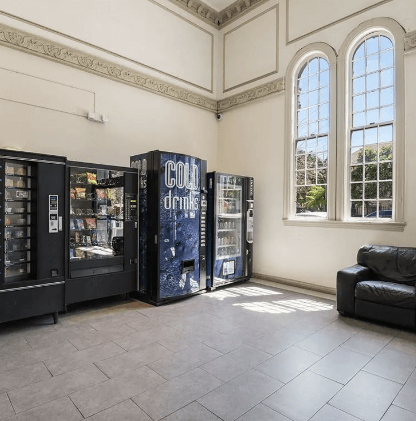 the inside of a building with vending machines