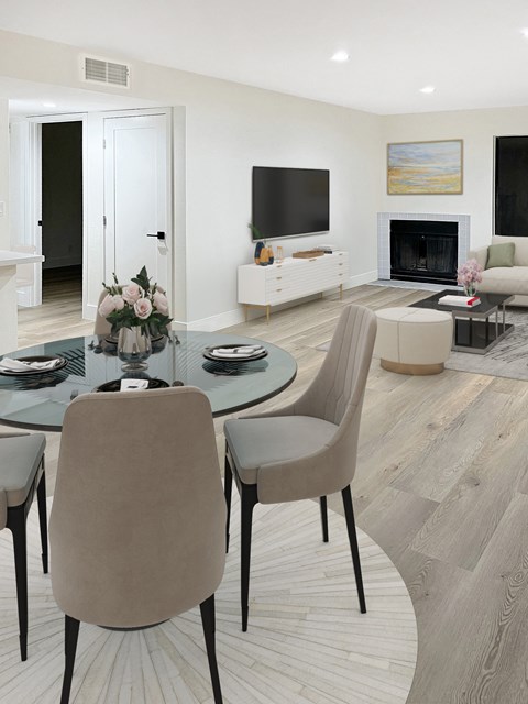 a living room with a table and chairs