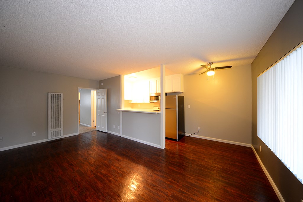 University Gardens unfurnished living room and dining area