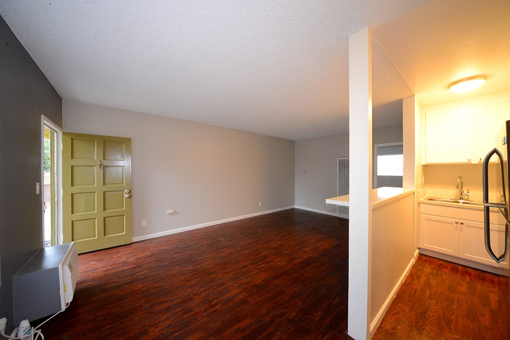 University Gardens unfurnished living, dining, and kitchen area