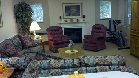 a living room with couches and chairs