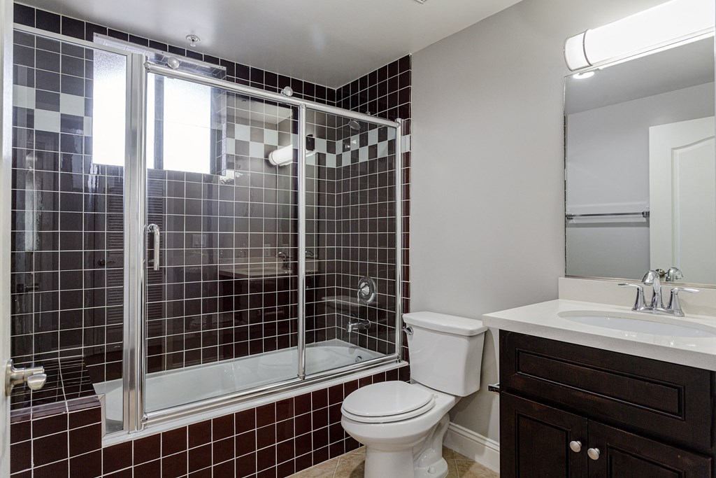 Villa Sofia Homes bathroom with toilet, sink, and shower