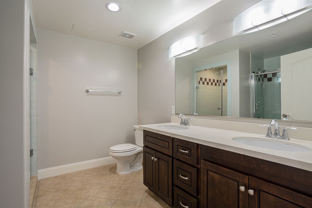Villa Sofia Homes spacious bathroom with sink, toilet, and shower