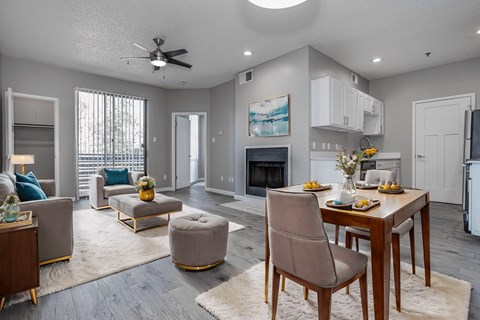 an open living room and dining room with a table and chairs