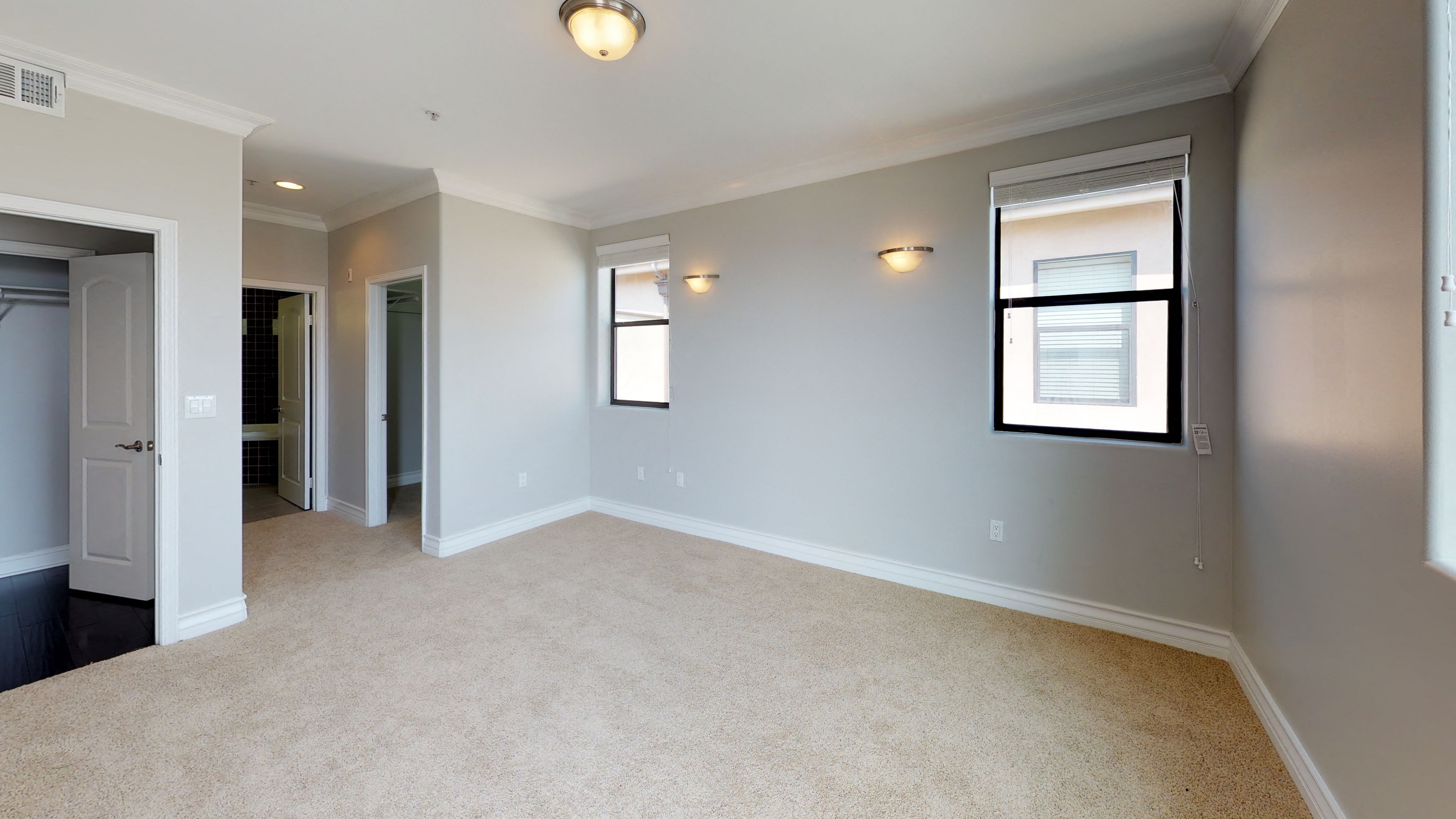 Vista Paradiso three bedroom unit interior room with carpet and windows 1