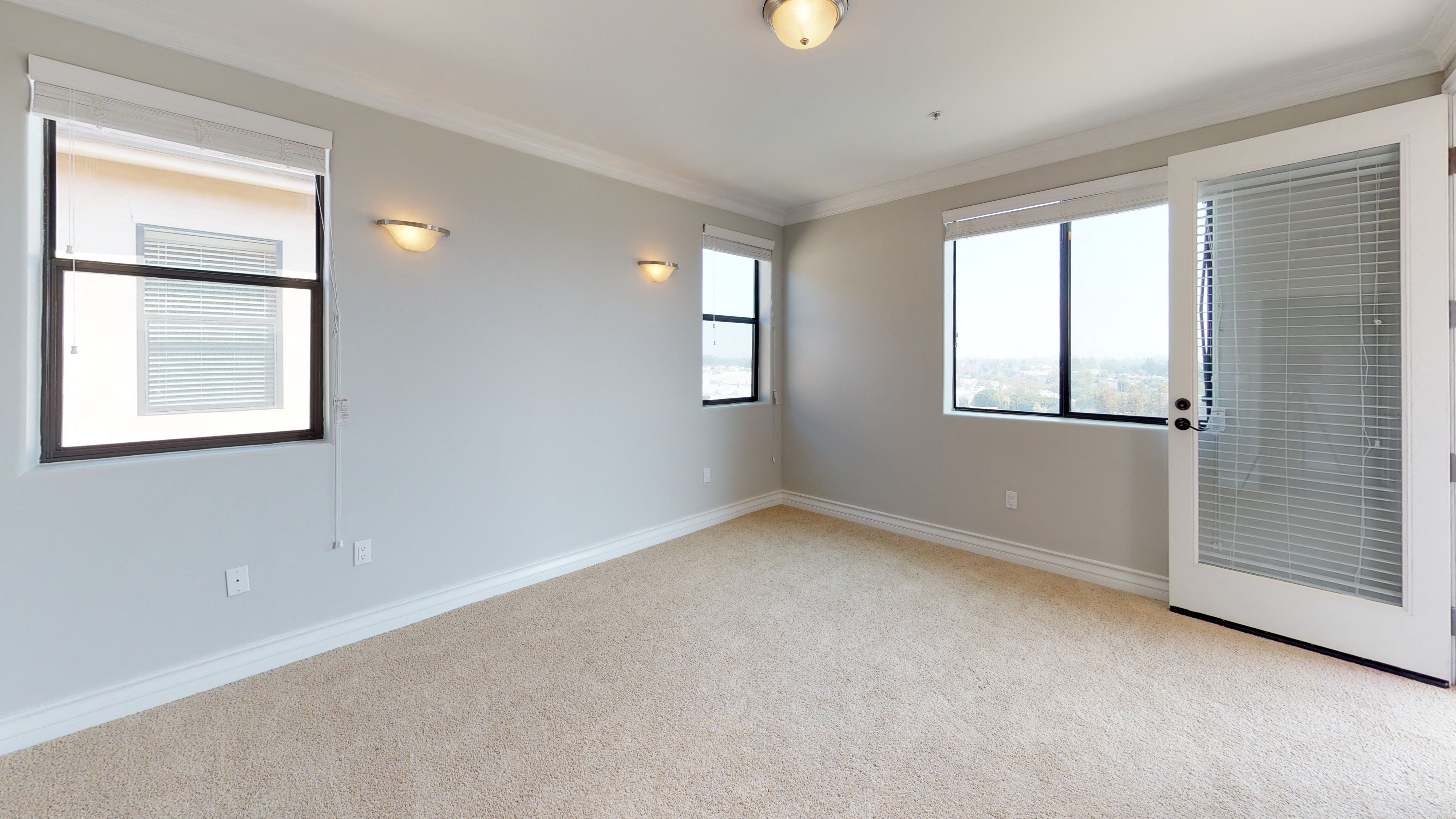 Vista Paradiso three bedroom unit interior room with carpet and windows 2