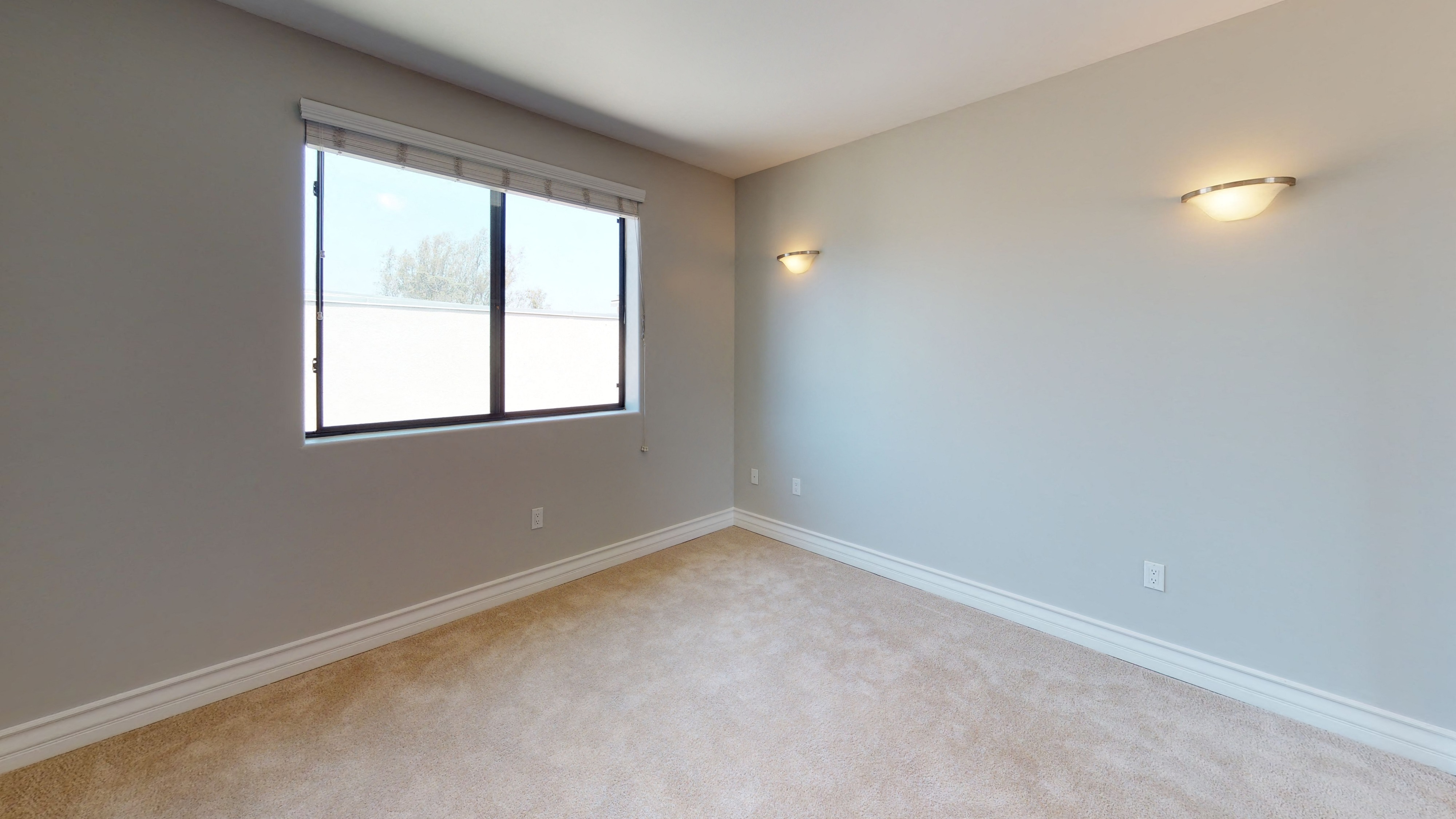 Vista Paradiso two bedroom unit interior room with carpet and window 1