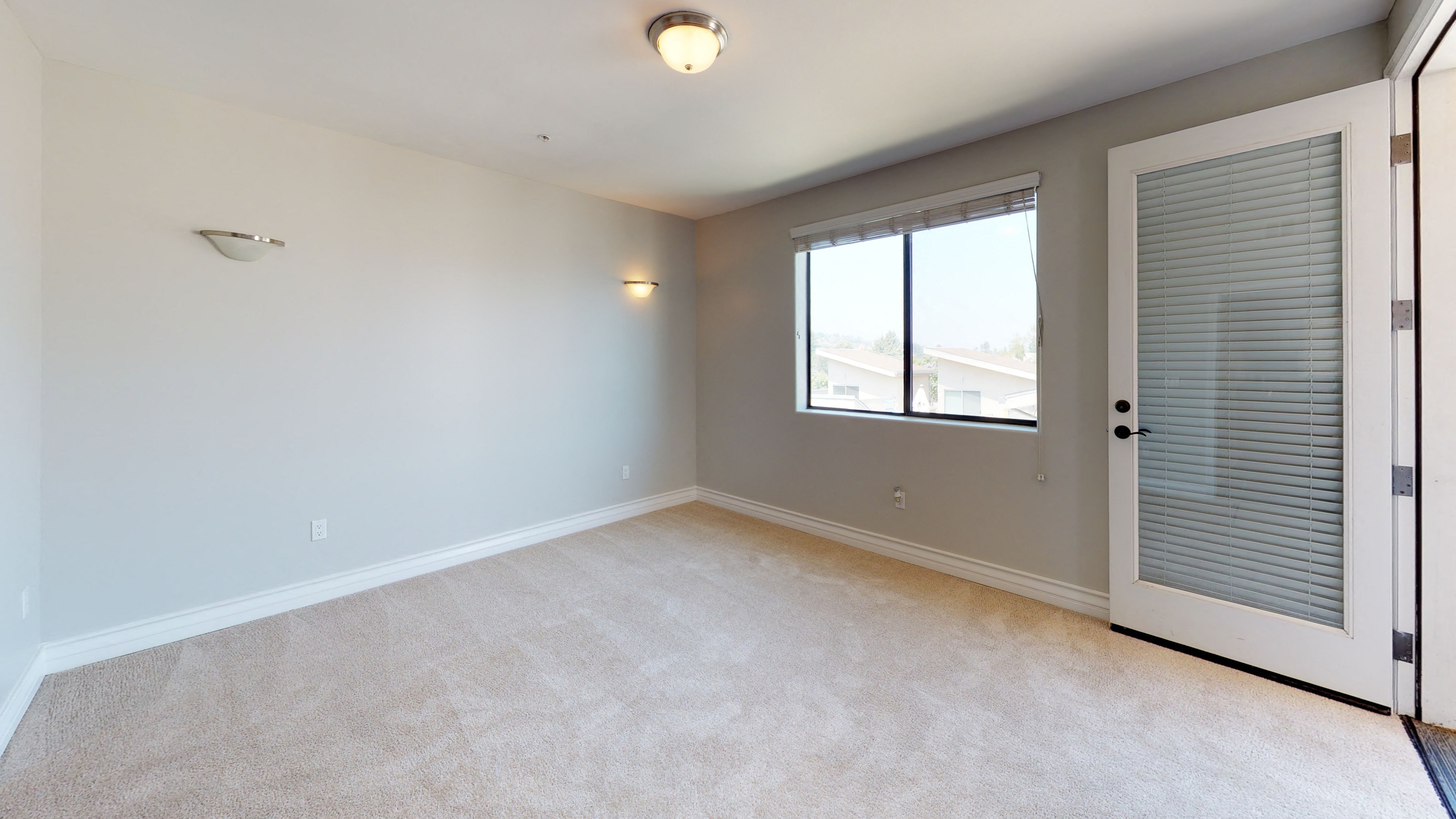 Vista Paradiso two bedroom unit interior room with carpet and window 2