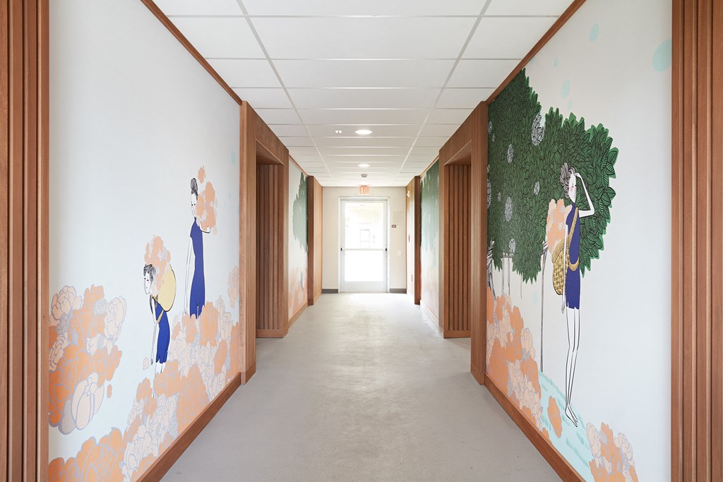 WakeaGardens_InteriorHallway_WallMuralsOnBothSides