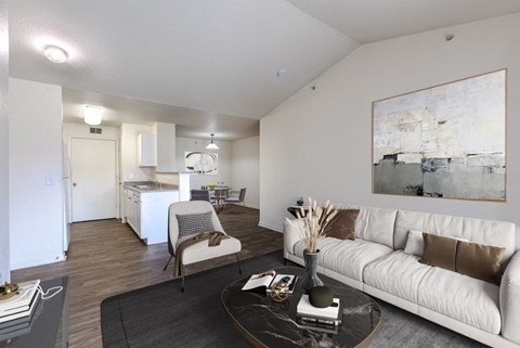 A living room with a white couch and a coffee table.