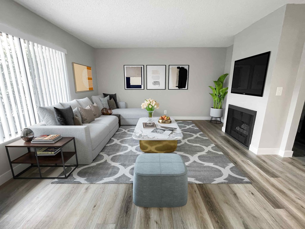 a living room with gray walls and a gray and white rug