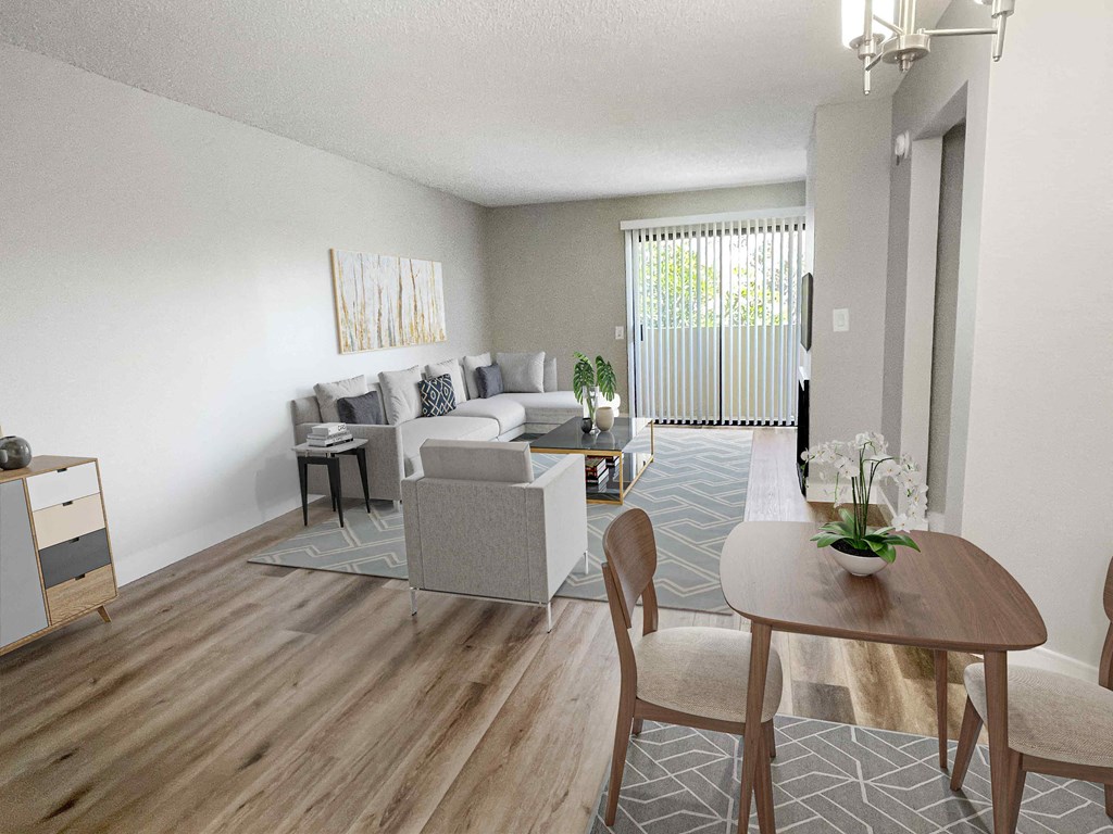 a living room with white walls and a wooden floor