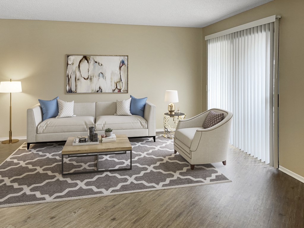a living room with a couch chair and coffee table