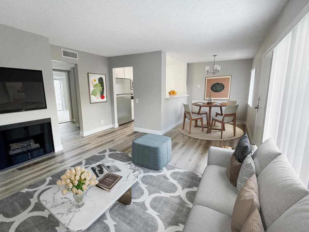 a living room with a couch a table and a chair