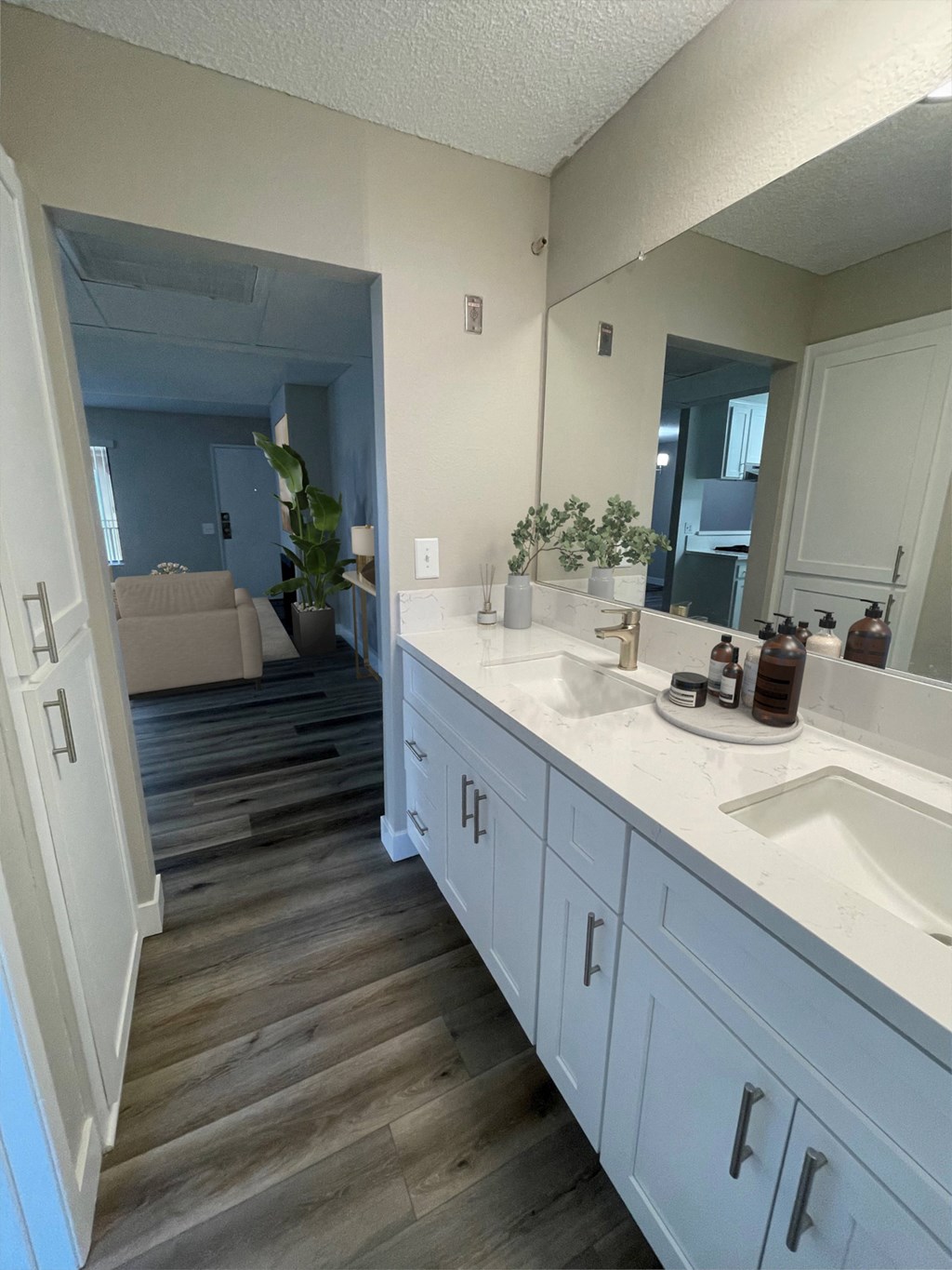 a bathroom with two sinks and a large mirror