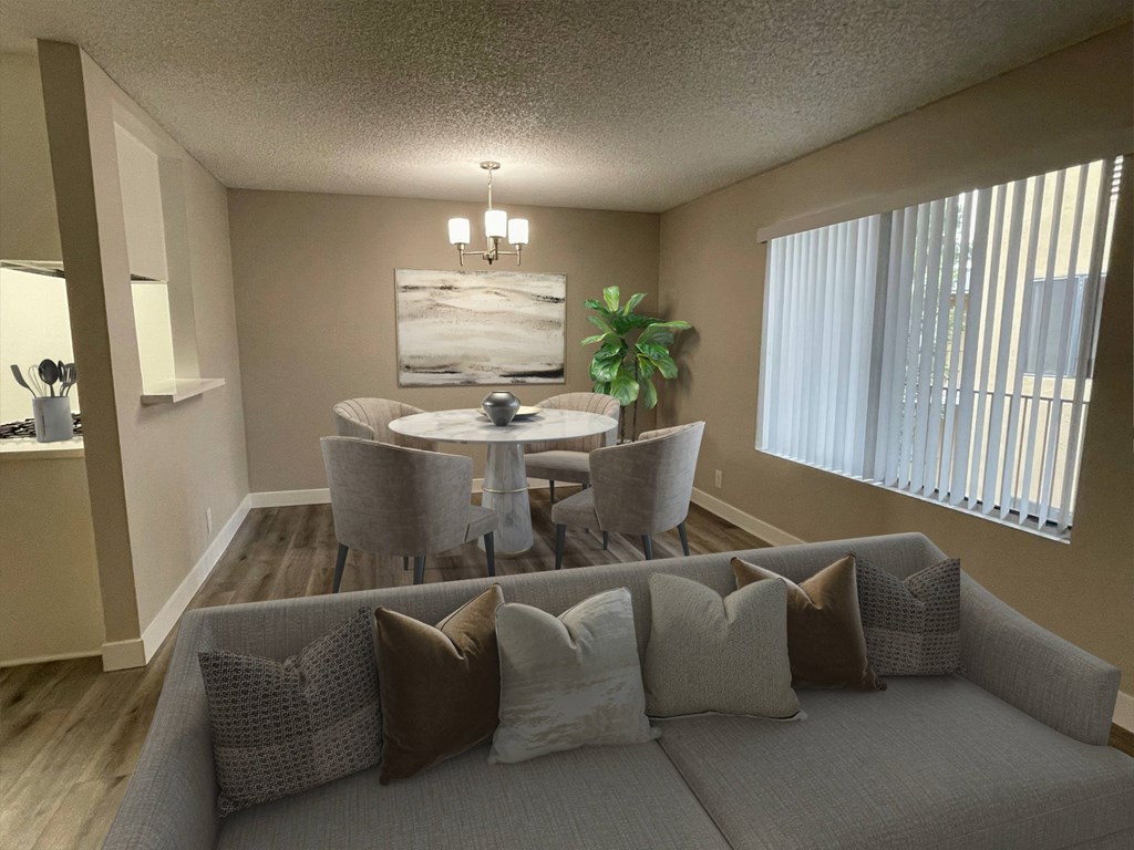 a living room with a couch and chairs and a table