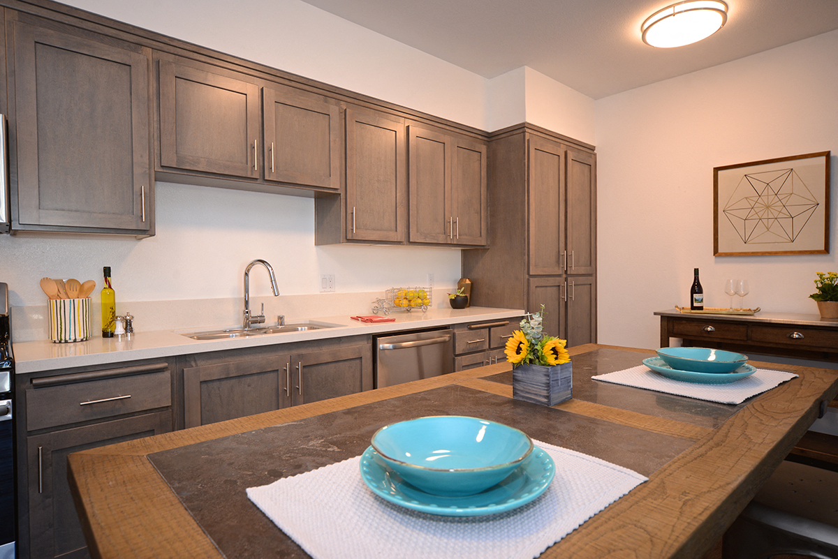 Yolo Apartments kitchen with appliances and activity hub