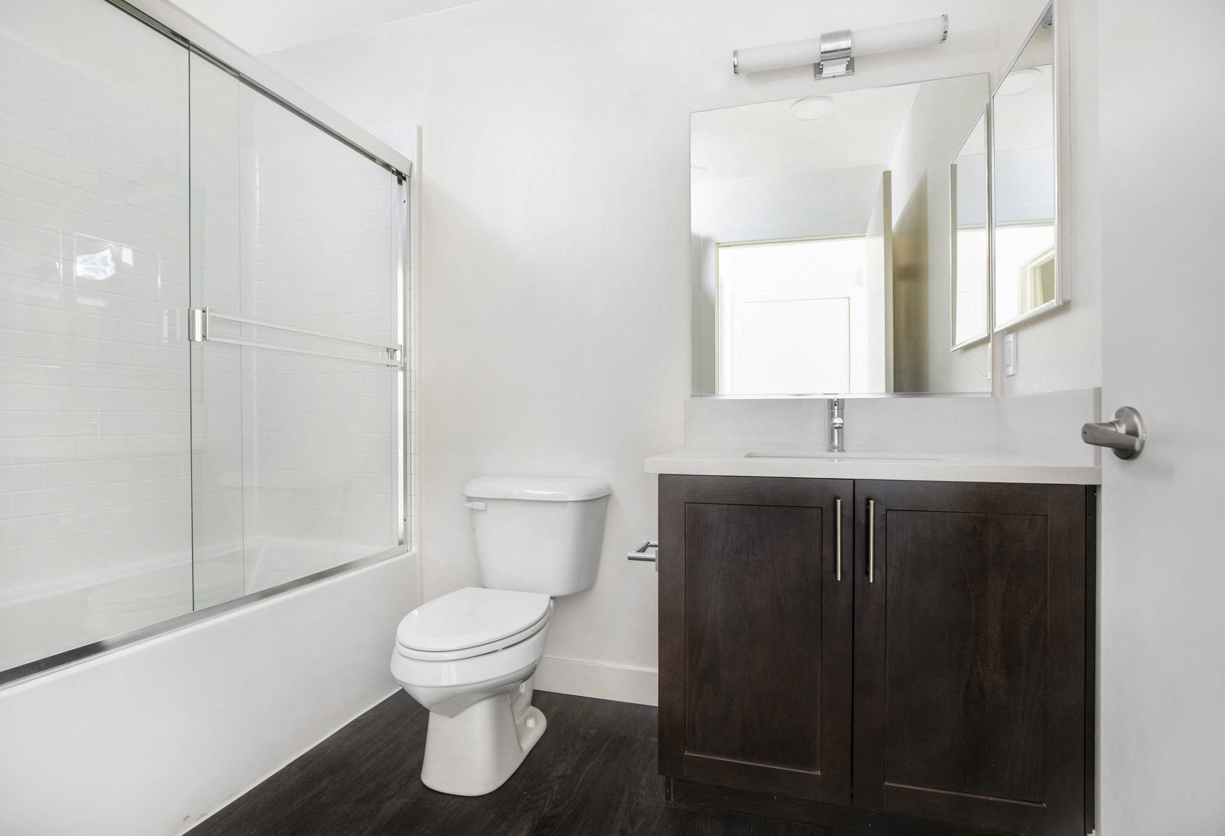 YOLO East bathroom vanity, toilet, and shower