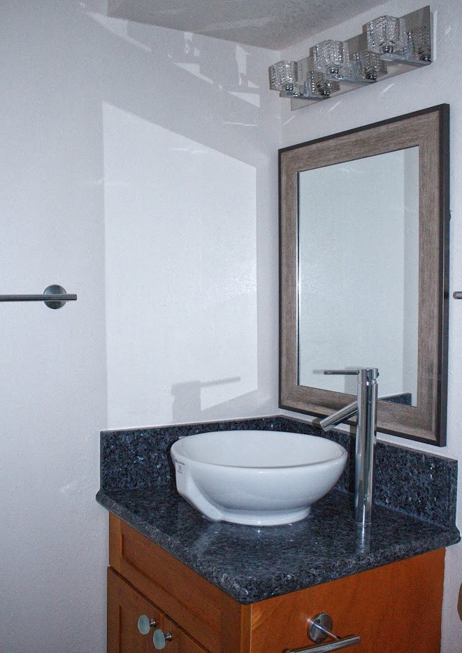 Napili Towers bathroom sink, mirror, and vanity