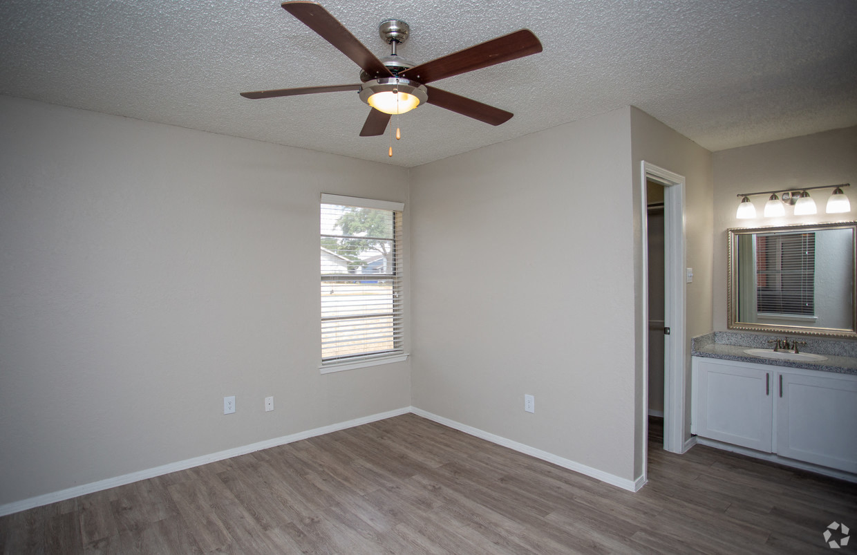 Bedford Oaks Apartments bedroom with sink and mirror