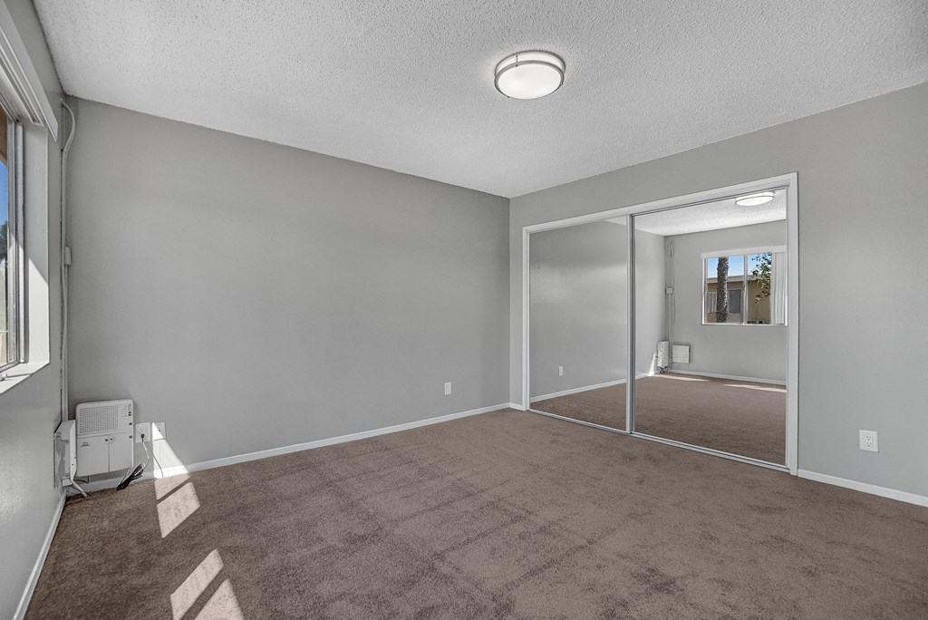 capistrano gardens unit 105 bedroom with mirrored closet