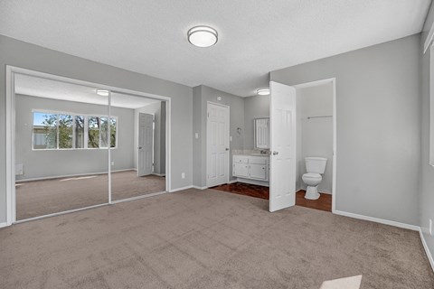 capistrano gardens unit 105 bedroom with view of bathroom