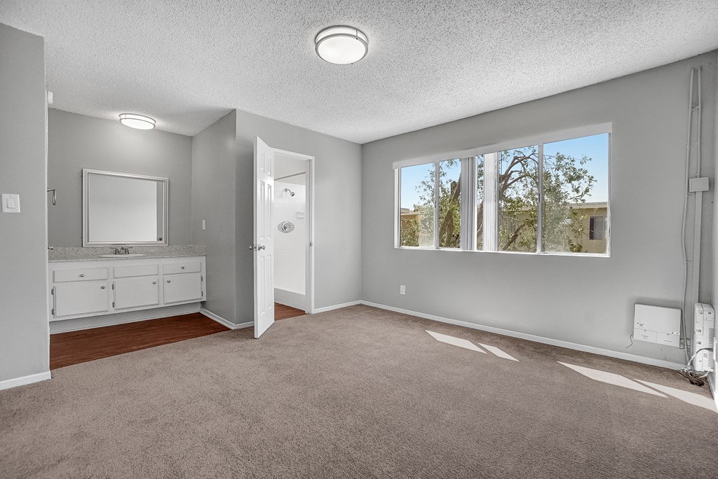 capistrano gardens unit 105 bedroom with view of vanity