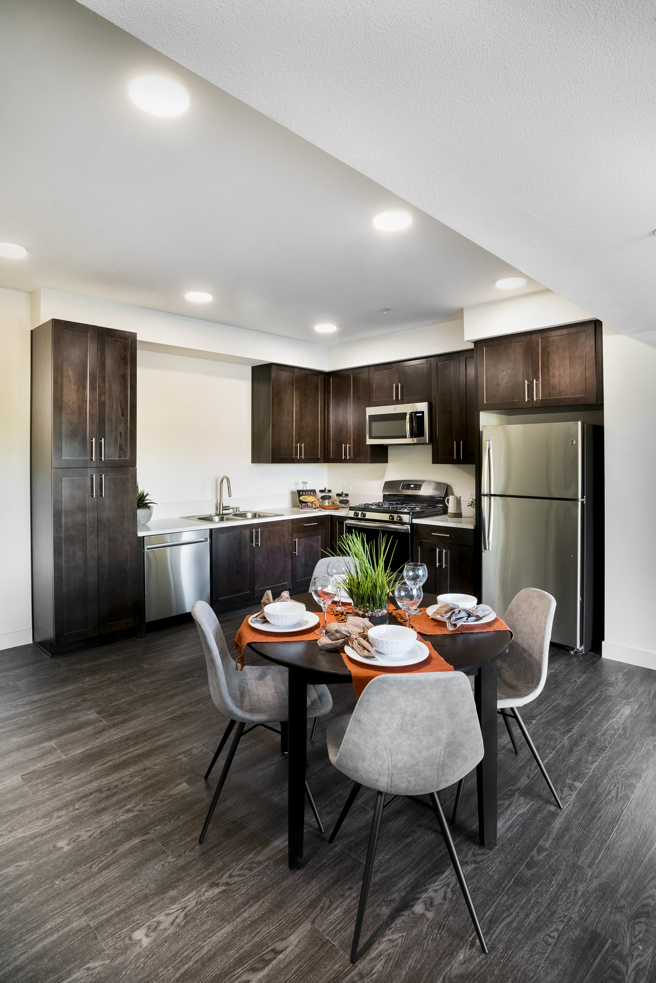 YOLO East dining table and kitchen area