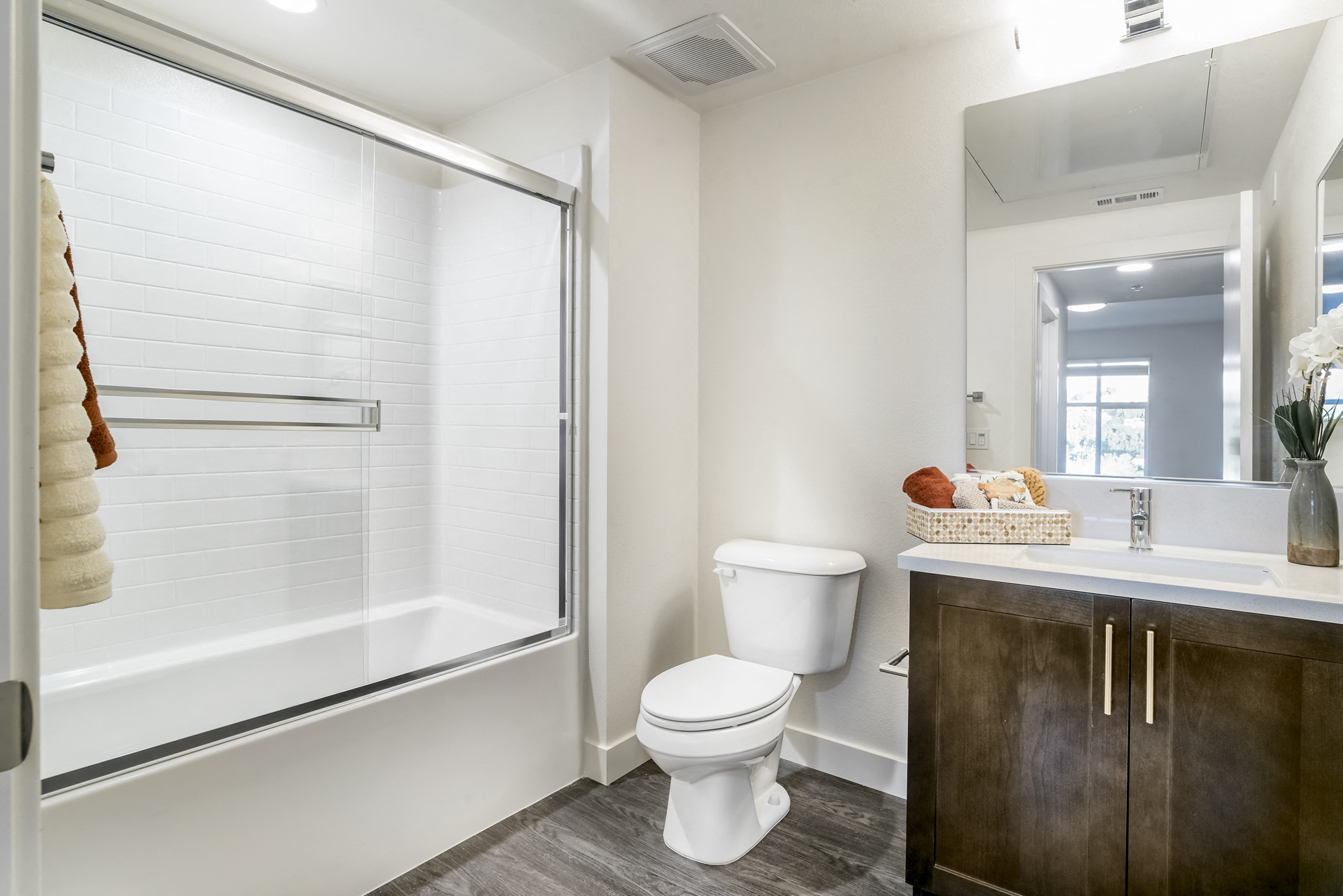 YOLO East bathroom vanity, toilet, and shower