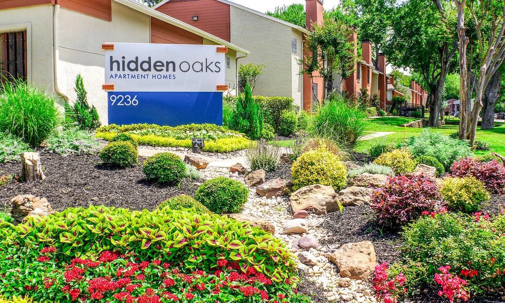 Hidden Oaks Apartment Homes garden and signage