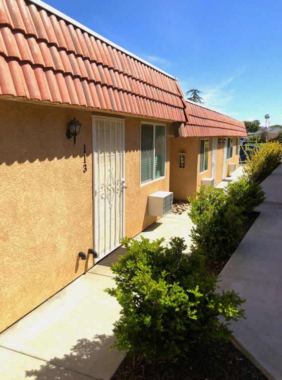 Limoncello Apartments exterior building and pathway
