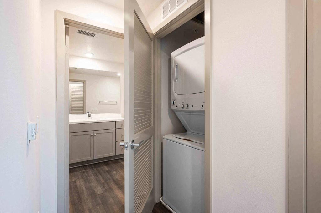 a laundry room with a washer and dryer in it