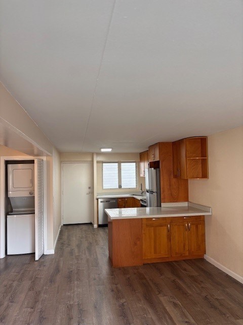 A kitchen with wooden cabinets and a white fridge.