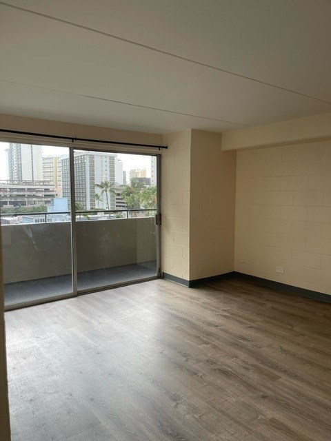 A room with a view of the city through the windows.