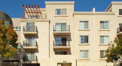 an apartment building with balconies on the side of it