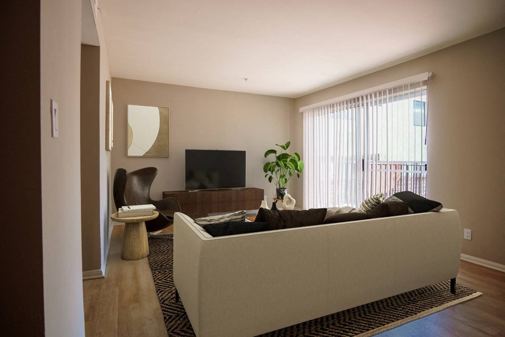 a living room with a couch and a tv