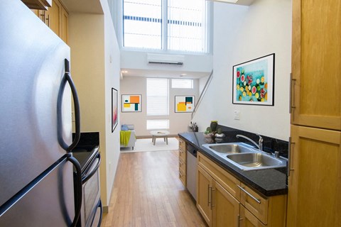 a kitchen with a sink and a refrigerator