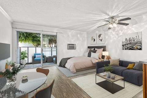A modern bedroom with a large bed and a balcony.