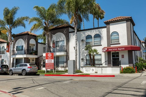 A building with a sign that says "Lease Today" in front of it.