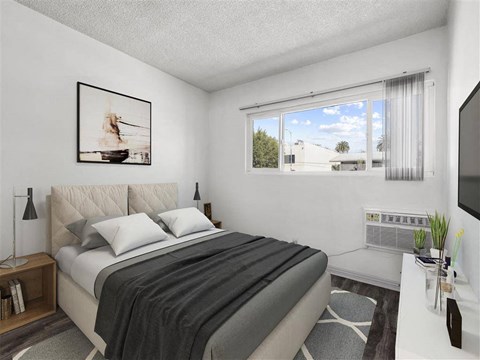 A bedroom with a large bed and a painting on the wall.