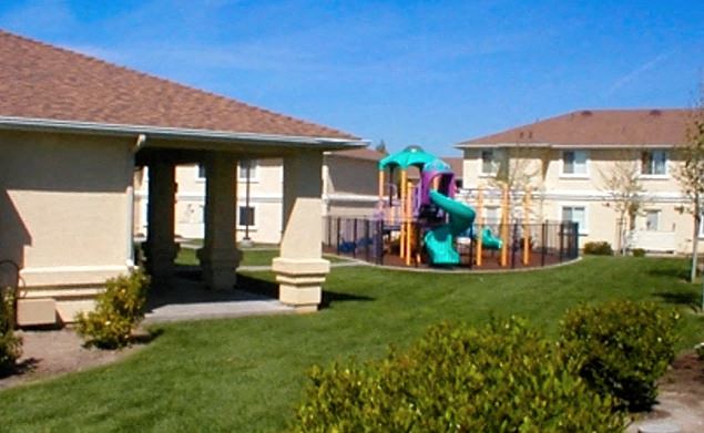 a house with a backyard with a playground